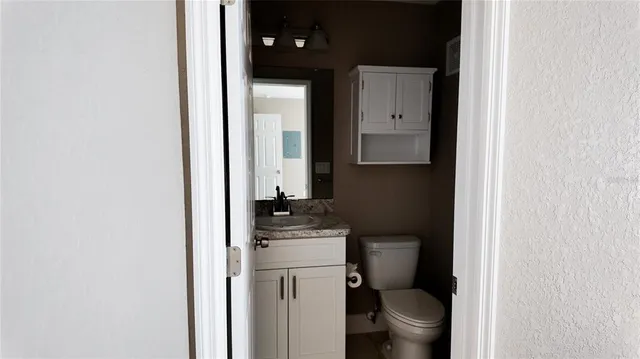 a bathroom with a toilet and a sink
