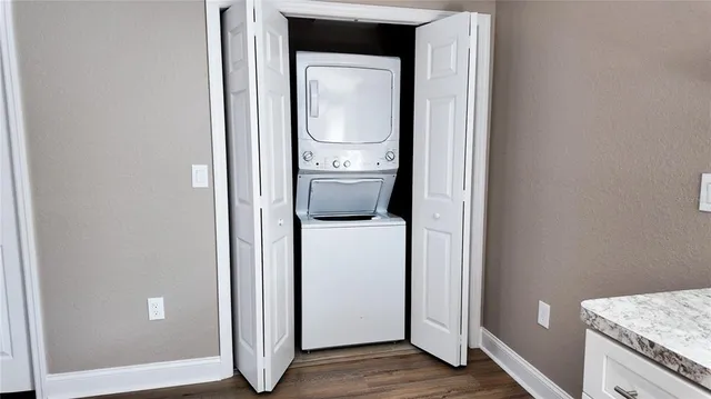 a view of a hallway with washer and dryer