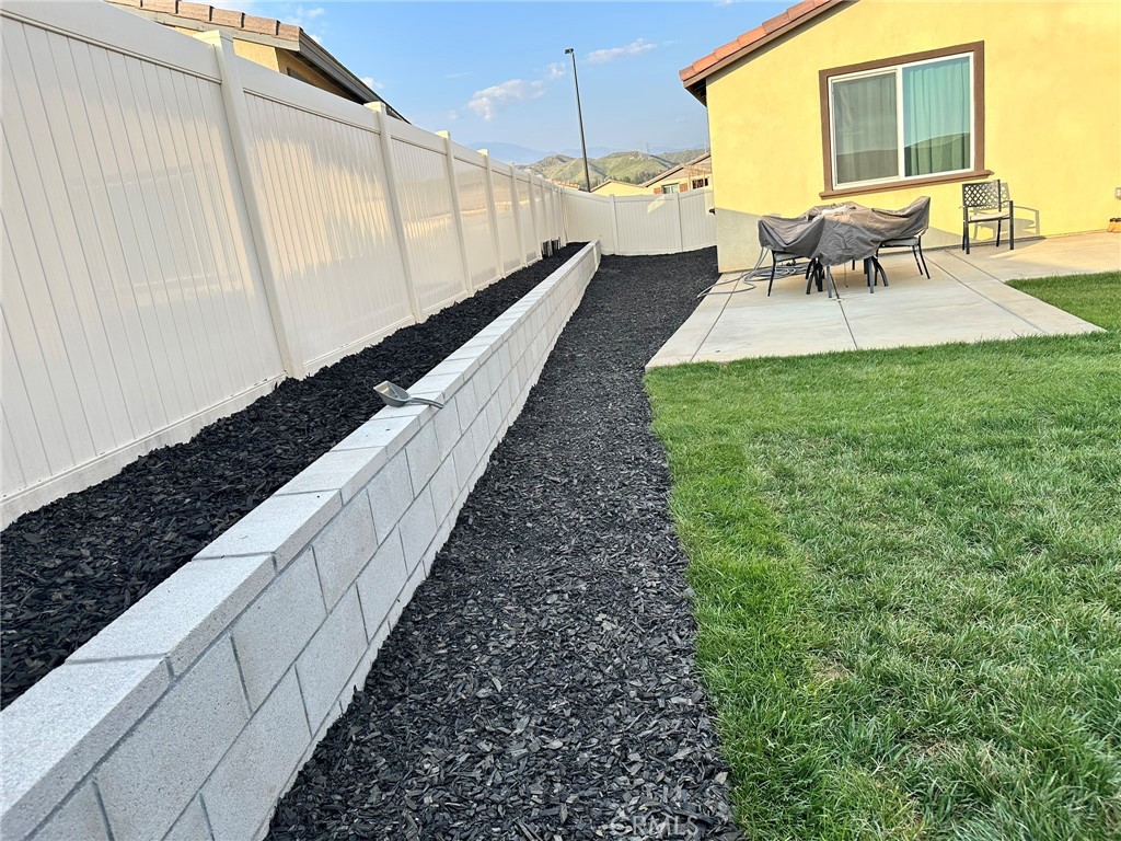 1351 Fiddleleaf Drive Banning, CA 92220 - Photo 12 of 16 a view of a backyard with sitting area