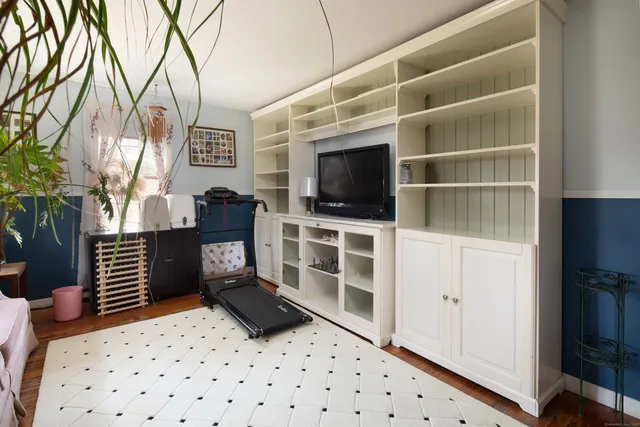 a room with furniture and a flat screen tv