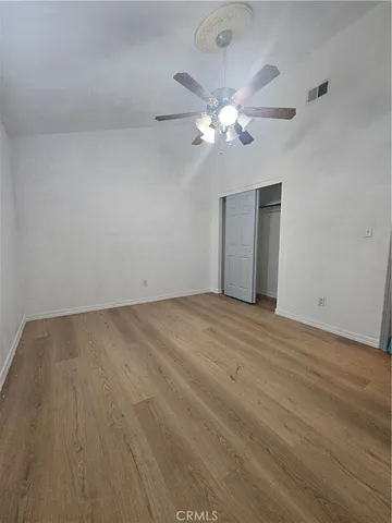 a room with a sink a mirror and a shower