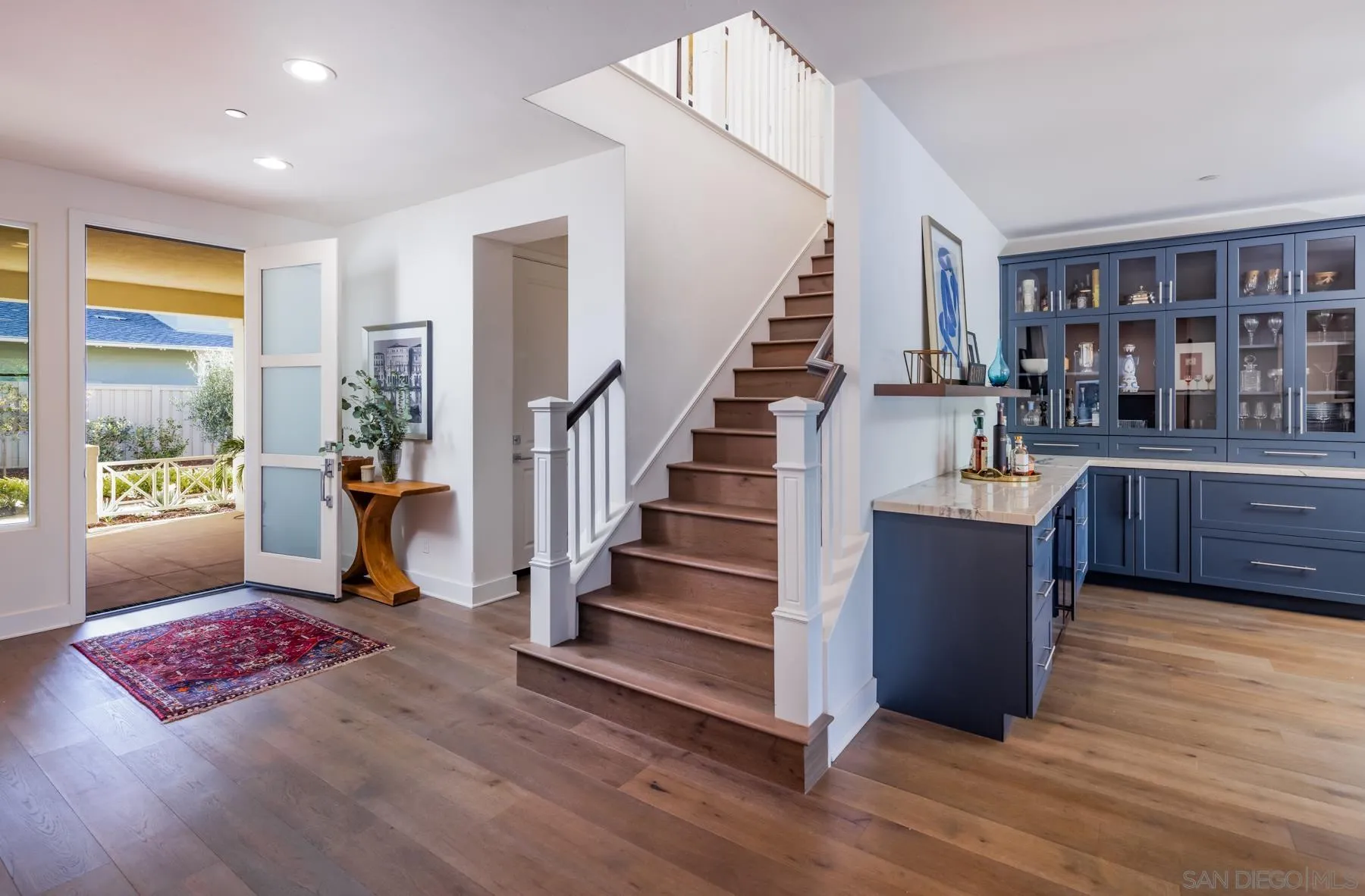 939 Moonstone Court Encinitas, CA 92024 - Photo 11 of 25 a living room with furniture and a rug