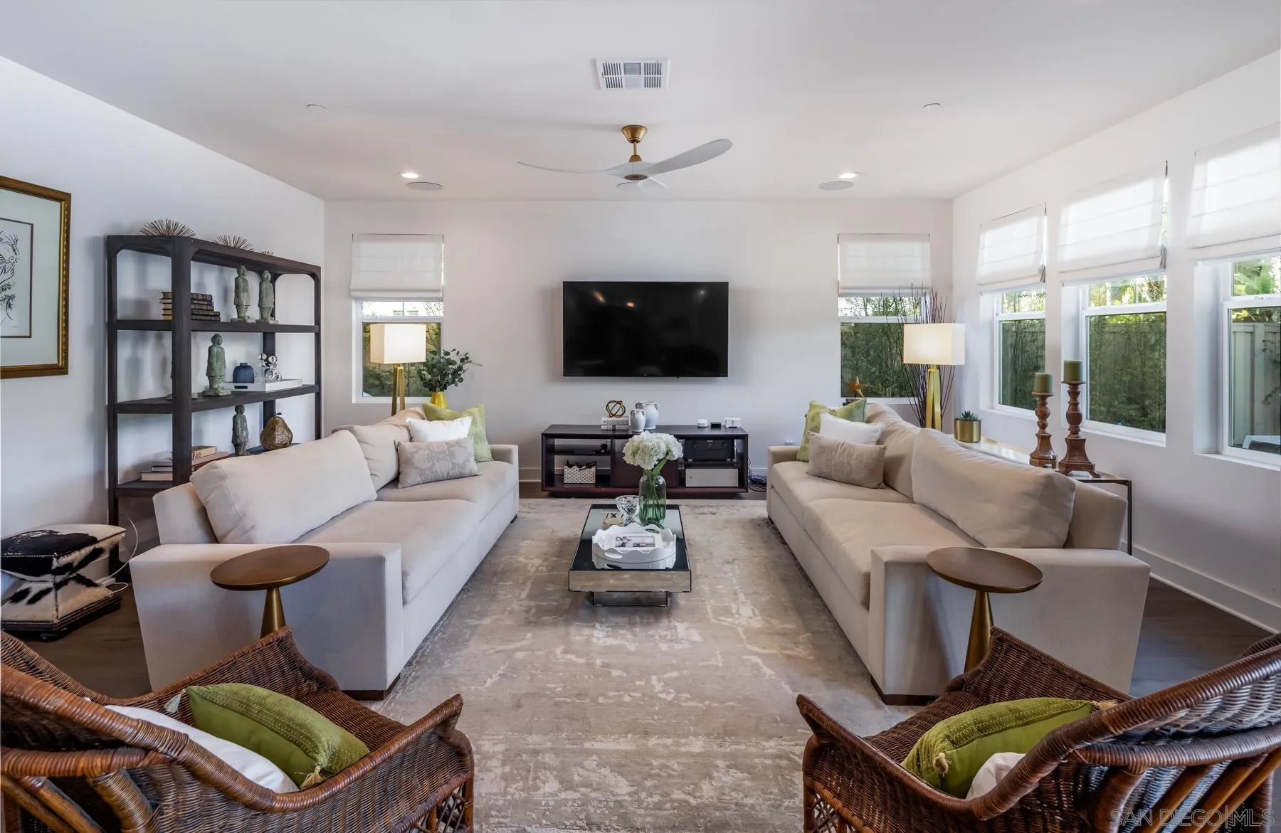 939 Moonstone Court Encinitas, CA 92024 - Photo 8 of 25 a living room with furniture and a flat screen tv