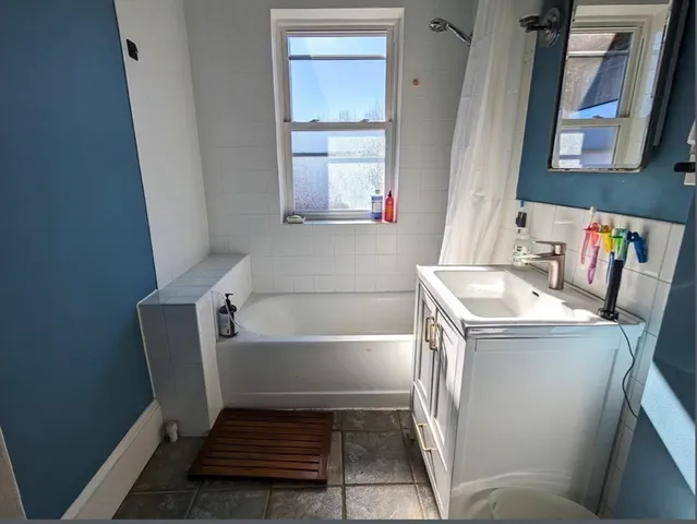 a bathroom with a sink and a bathtub