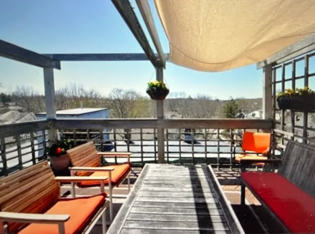 a view of swimming pool with seating area