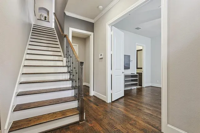 a view of a house with potted plants