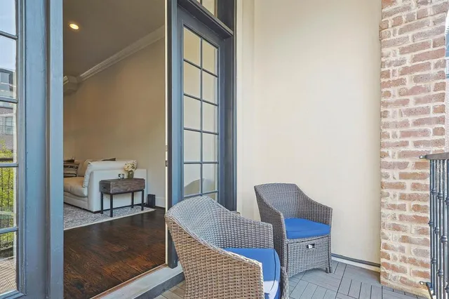 a balcony with furniture and a window