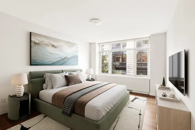 a dining room with furniture and a window