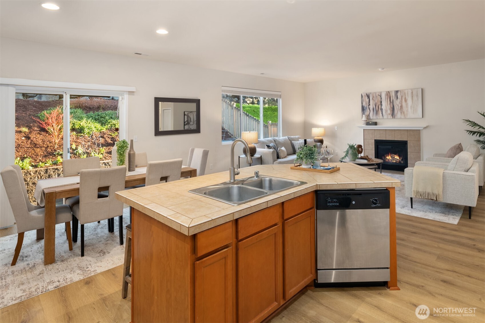 21272 Southeast 275th Court Maple Valley, WA 98038 - Photo 13 of 40 a kitchen with a stove a sink and a refrigerator