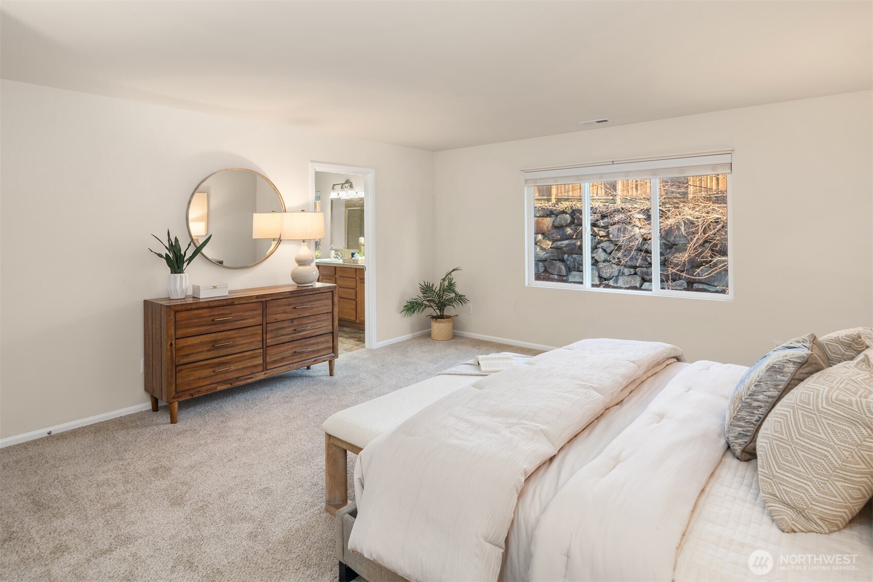 21272 Southeast 275th Court Maple Valley, WA 98038 - Photo 15 of 40 a bedroom with a bed dresser and a window