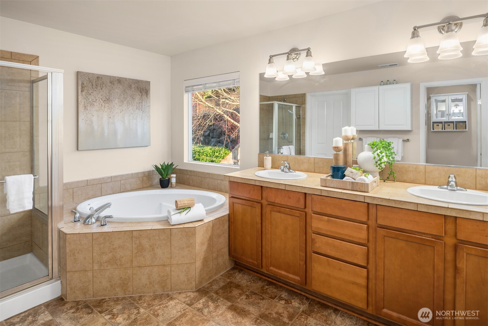 21272 Southeast 275th Court Maple Valley, WA 98038 - Photo 16 of 40 a bathroom with a tub sink and mirror