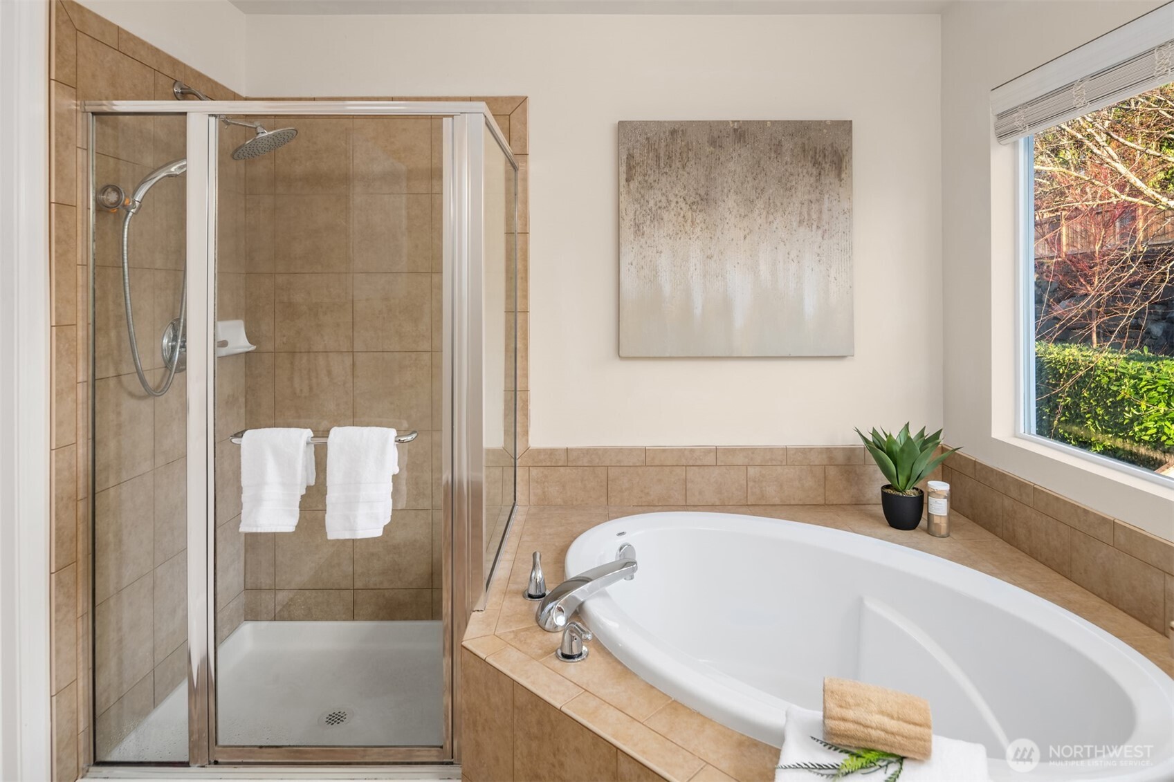 21272 Southeast 275th Court Maple Valley, WA 98038 - Photo 17 of 40 a bathroom with a tub and shower