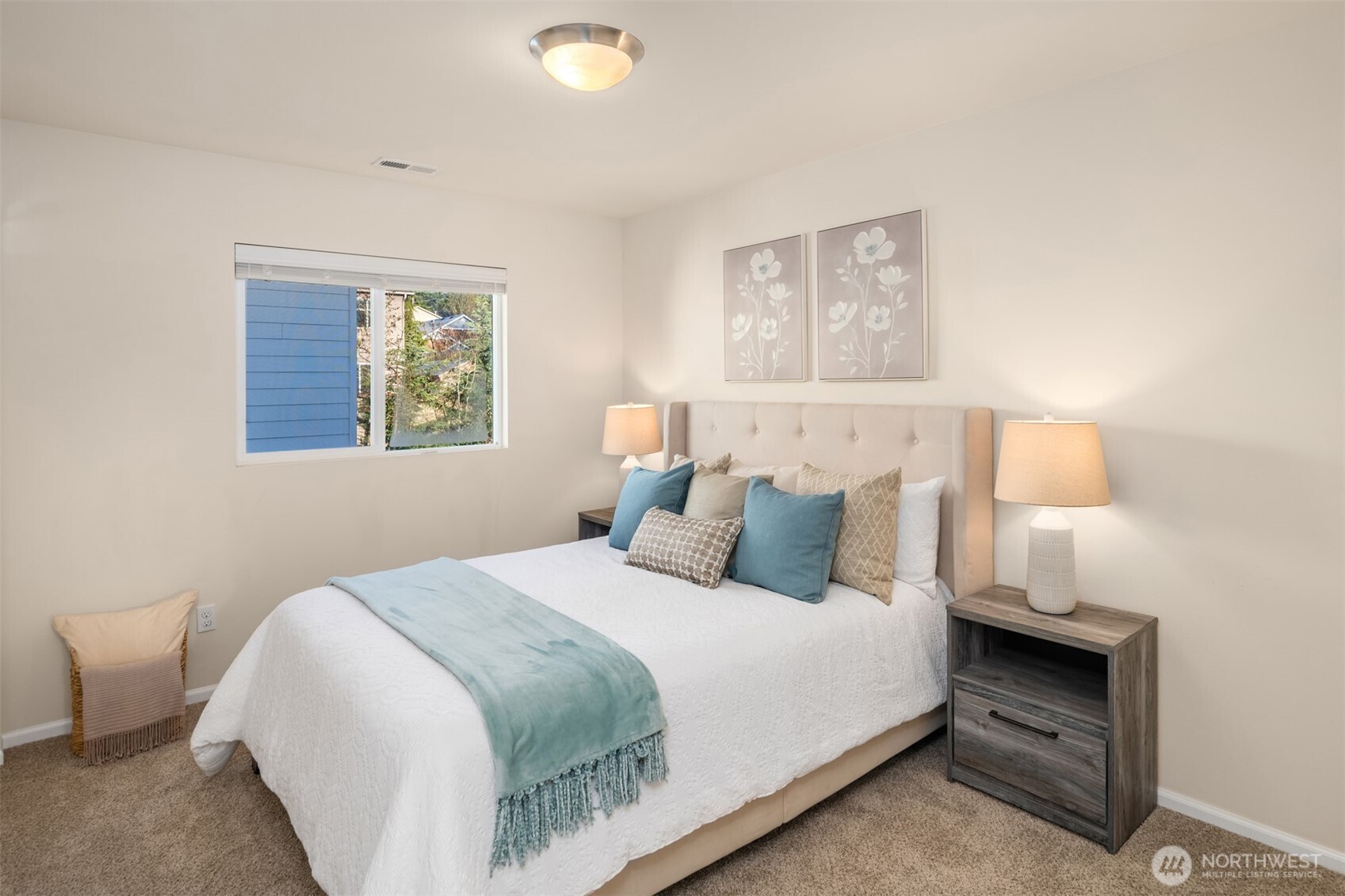 21272 Southeast 275th Court Maple Valley, WA 98038 - Photo 19 of 40 a bedroom with a bed and a painting on the wall