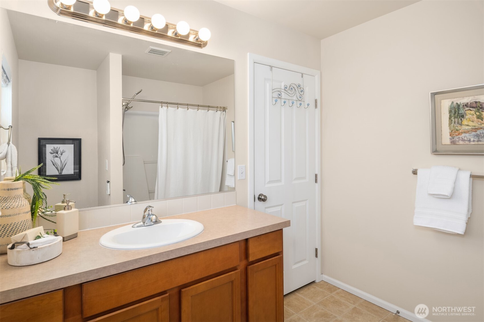 21272 Southeast 275th Court Maple Valley, WA 98038 - Photo 20 of 40 a bathroom with a sink and a mirror