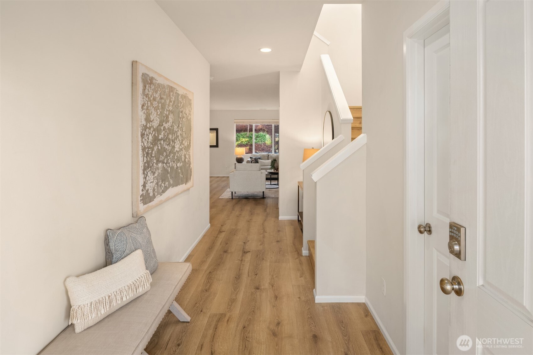 21272 Southeast 275th Court Maple Valley, WA 98038 - Photo 2 of 40 a view of a bedroom with wooden floor and staircase