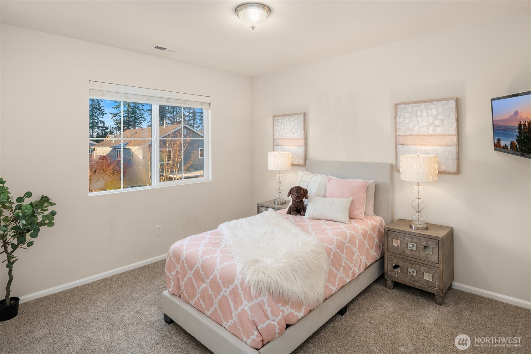 21272 Southeast 275th Court Maple Valley, WA 98038 - Photo 21 of 40 a bedroom with a bed and a window