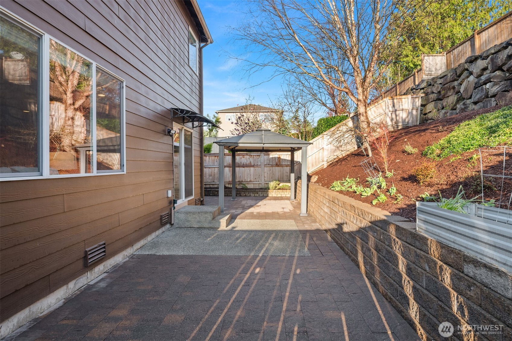 21272 Southeast 275th Court Maple Valley, WA 98038 - Photo 25 of 40 a view of a backyard with sitting area