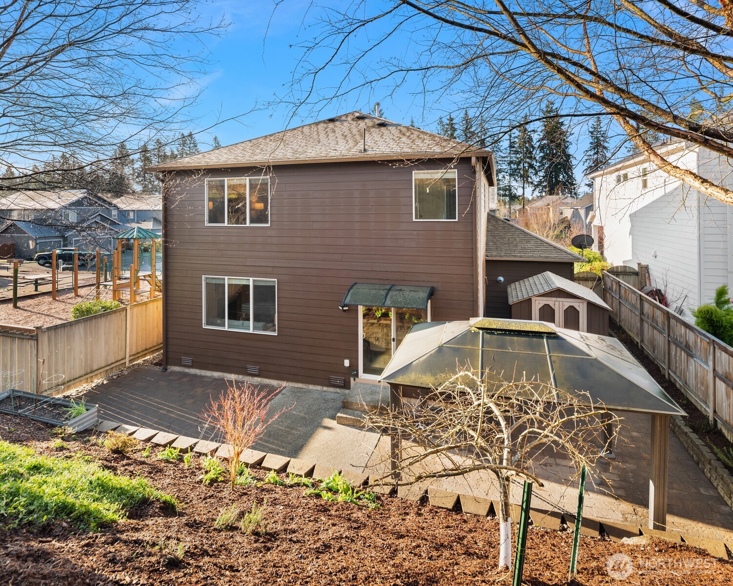 21272 Southeast 275th Court Maple Valley, WA 98038 - Photo 27 of 40 a front view of a house with a yard