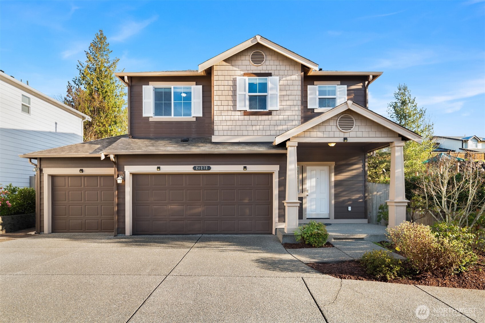 21272 Southeast 275th Court Maple Valley, WA 98038 - Photo 38 of 40 a front view of a house with a yard and garage