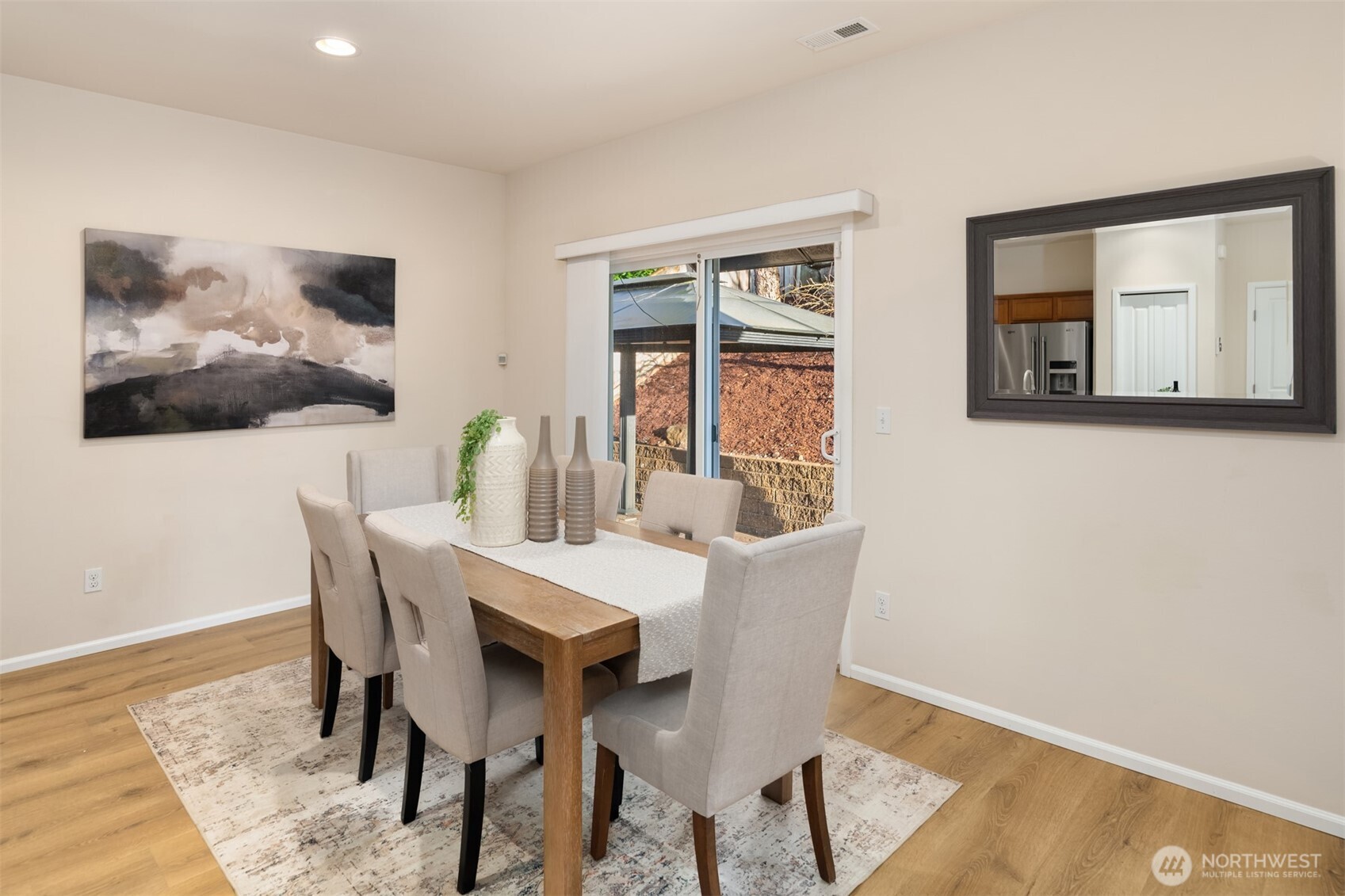21272 Southeast 275th Court Maple Valley, WA 98038 - Photo 9 of 40 a view of a dining room with furniture window and wooden floor