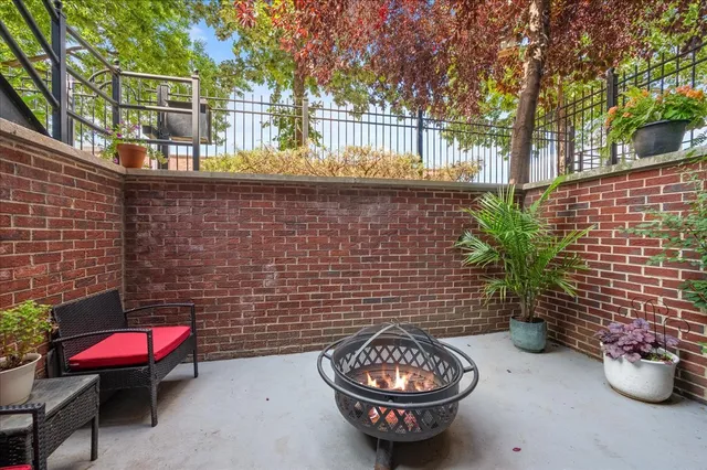 a view of a chairs and table in backyard