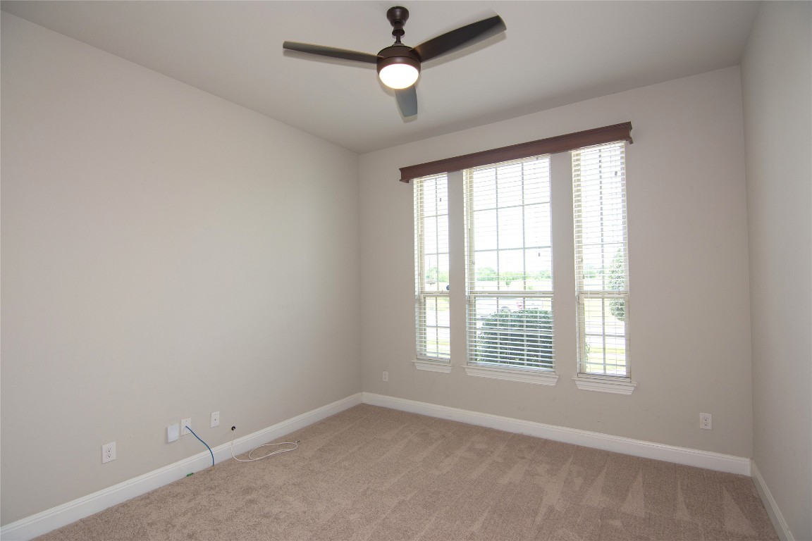 3901 Rhythmic Drive Pflugerville, TX 78660 - Photo 17 of 40 a view of an empty room with a window