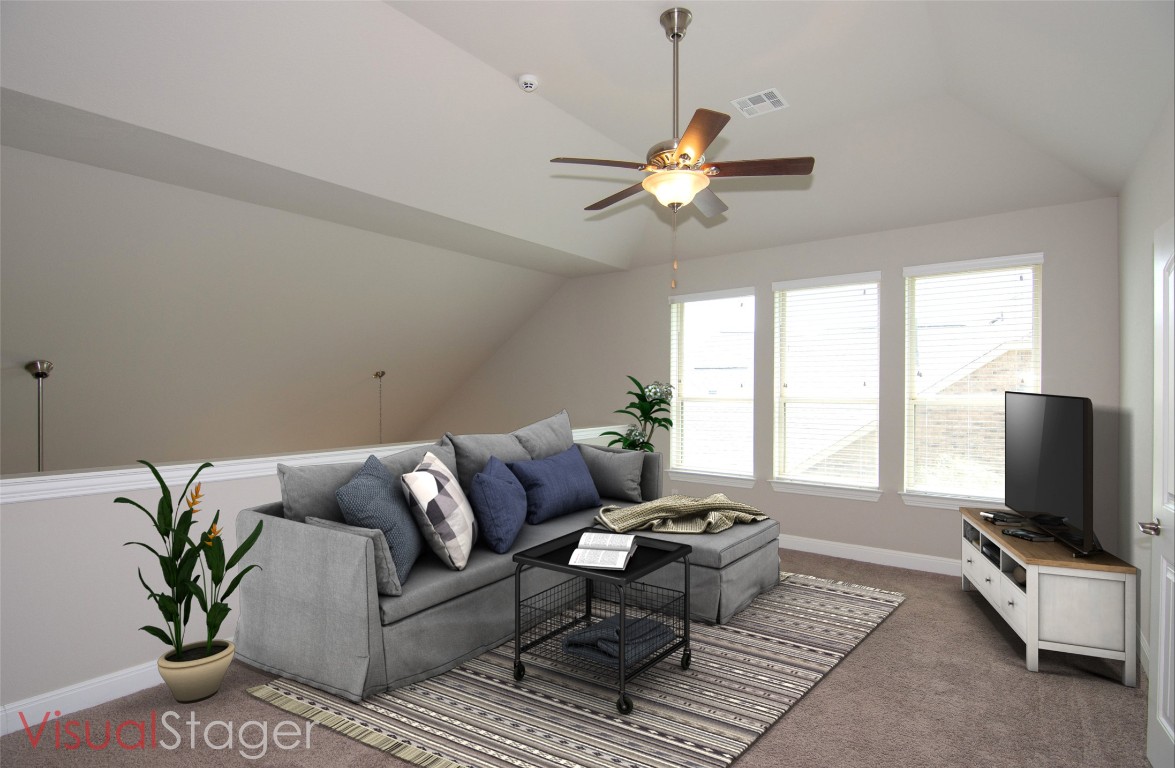 3901 Rhythmic Drive Pflugerville, TX 78660 - Photo 22 of 40 a living room with furniture and a flat screen tv