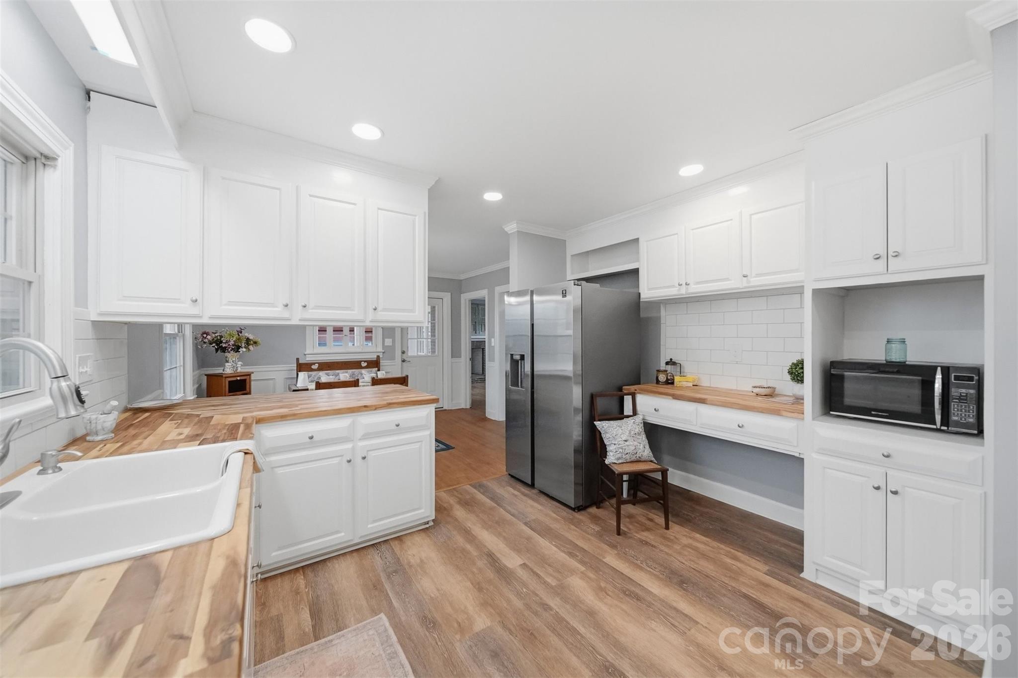 705 2nd Avenue Northeast Conover, NC 28613 - Photo 12 of 43 a kitchen with a sink a counter top space stainless steel appliances and cabinets