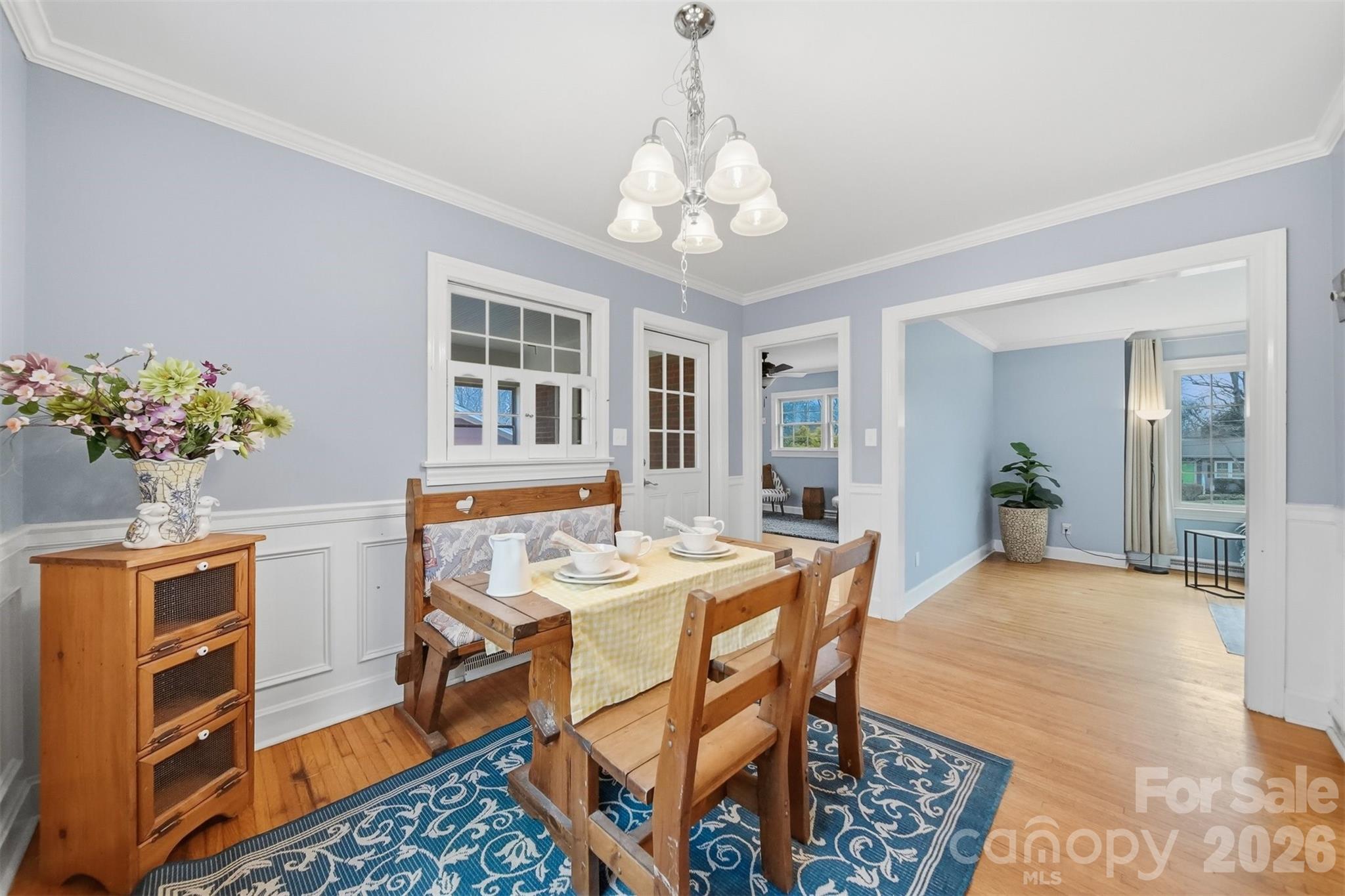 705 2nd Avenue Northeast Conover, NC 28613 - Photo 17 of 43 a view of a dining room with furniture and a chandelier