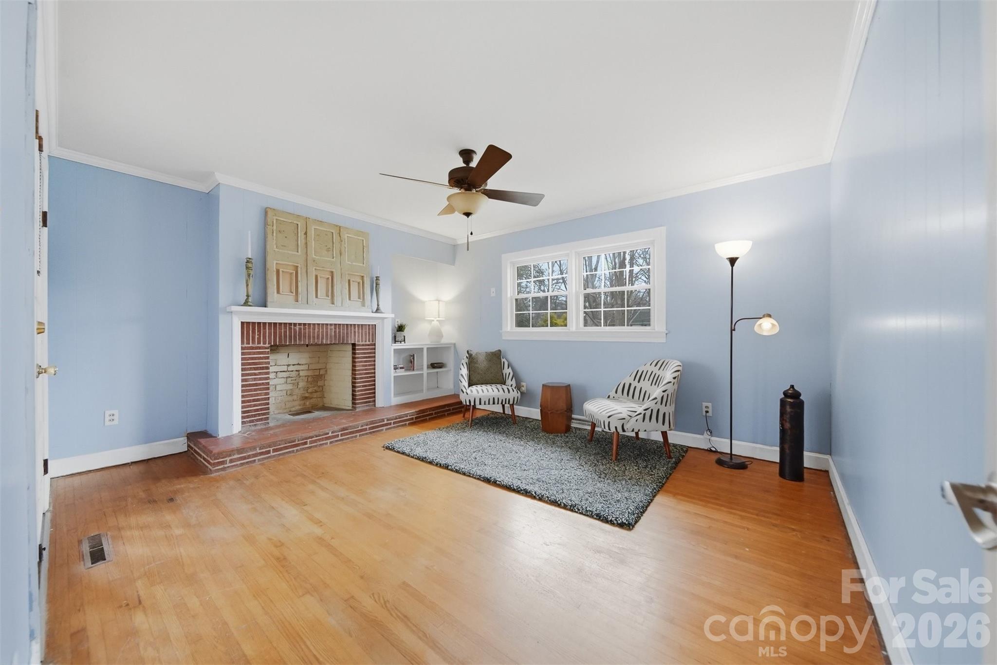 705 2nd Avenue Northeast Conover, NC 28613 - Photo 19 of 43 a bed room with a bed and a fireplace