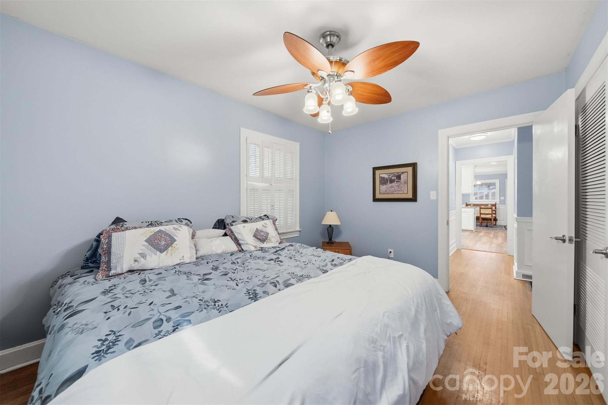 705 2nd Avenue Northeast Conover, NC 28613 - Photo 29 of 43 a bedroom with a large bed and a chandelier
