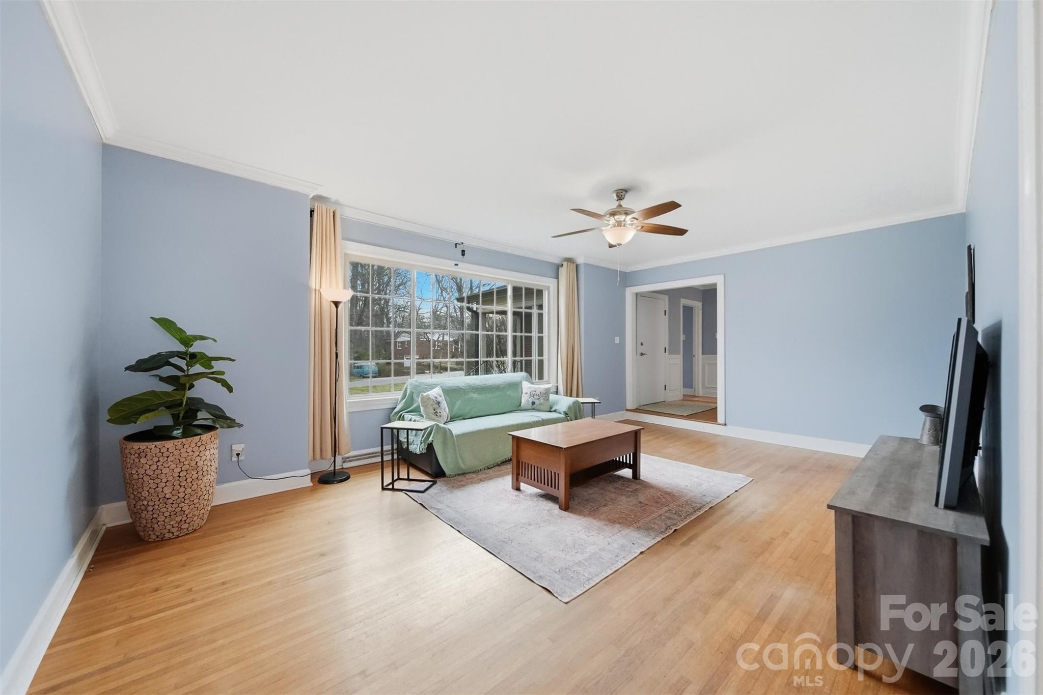 705 2nd Avenue Northeast Conover, NC 28613 - Photo 3 of 43 a living room with furniture floor to ceiling window and a table