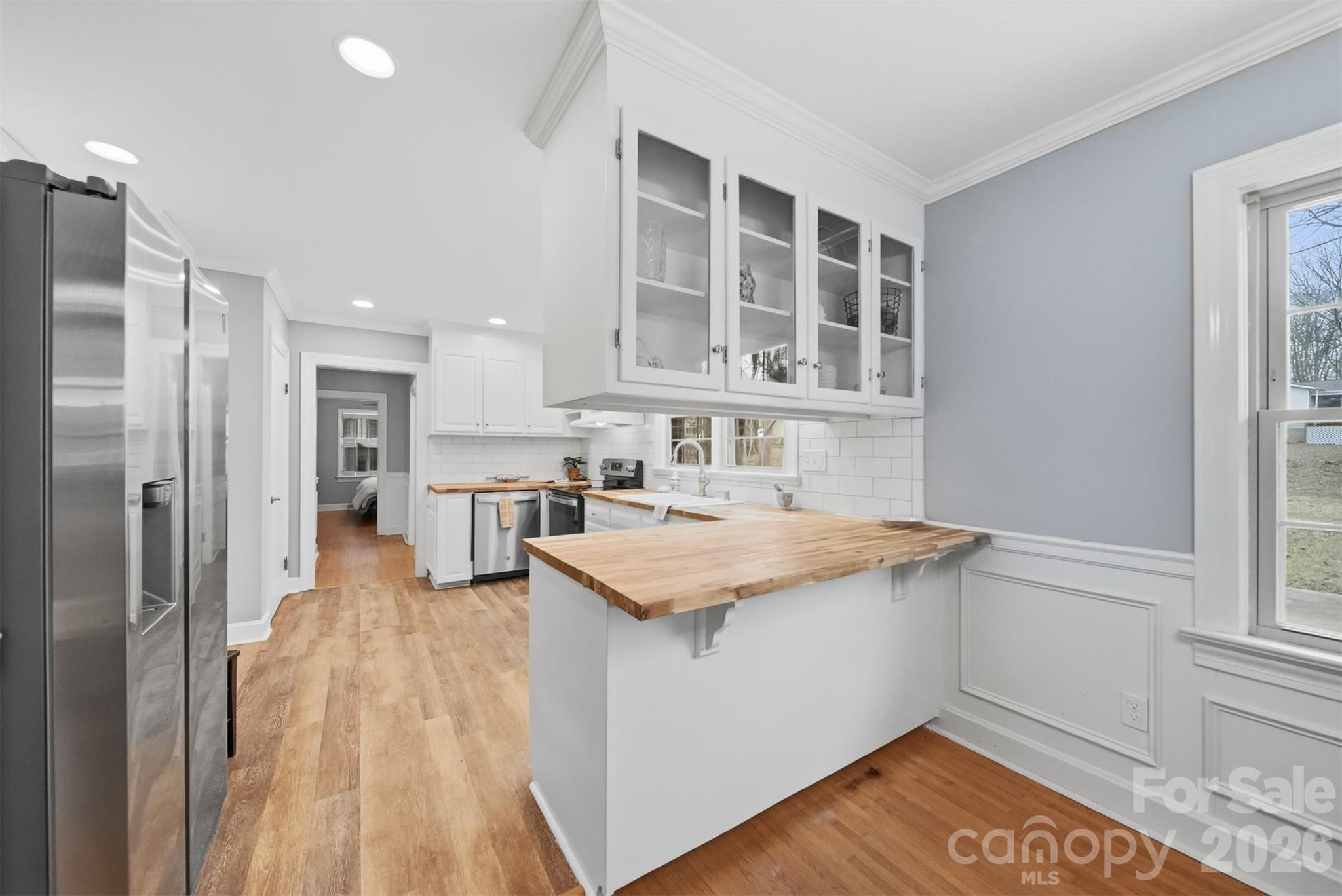 705 2nd Avenue Northeast Conover, NC 28613 - Photo 4 of 43 a kitchen with a sink and a refrigerator