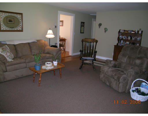 38 Gault Road Wareham, MA 02576 - Photo 2 of 6 a living room with furniture a couch and a potted plant