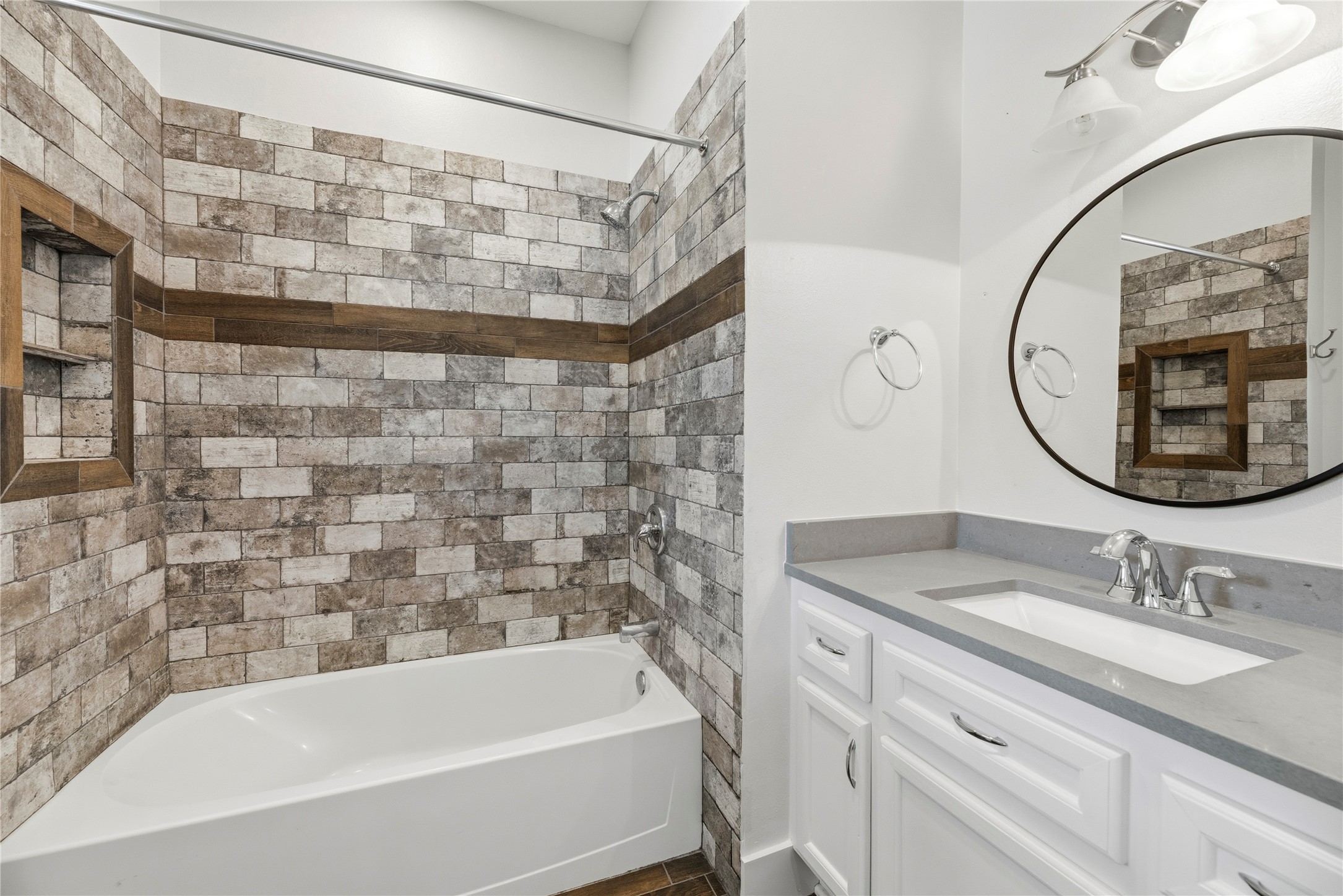12062 Ike White Road Conroe, TX 77303 - Photo 22 of 37 Private bathroom with a tub/shower combination and large vanity.