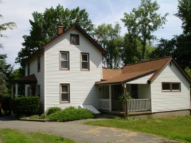 67 Laurel Hill Road Brookfield, CT 06804 - Photo 1 of 1 a front view of a white house with a yard and garage