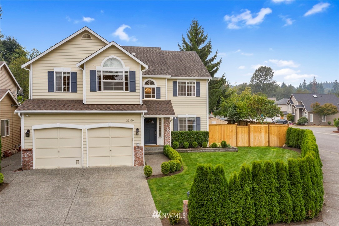 23100 14th Drive Southeast Bothell, WA 98021 - Photo 1 of 30 a front view of a house with a yard and garage