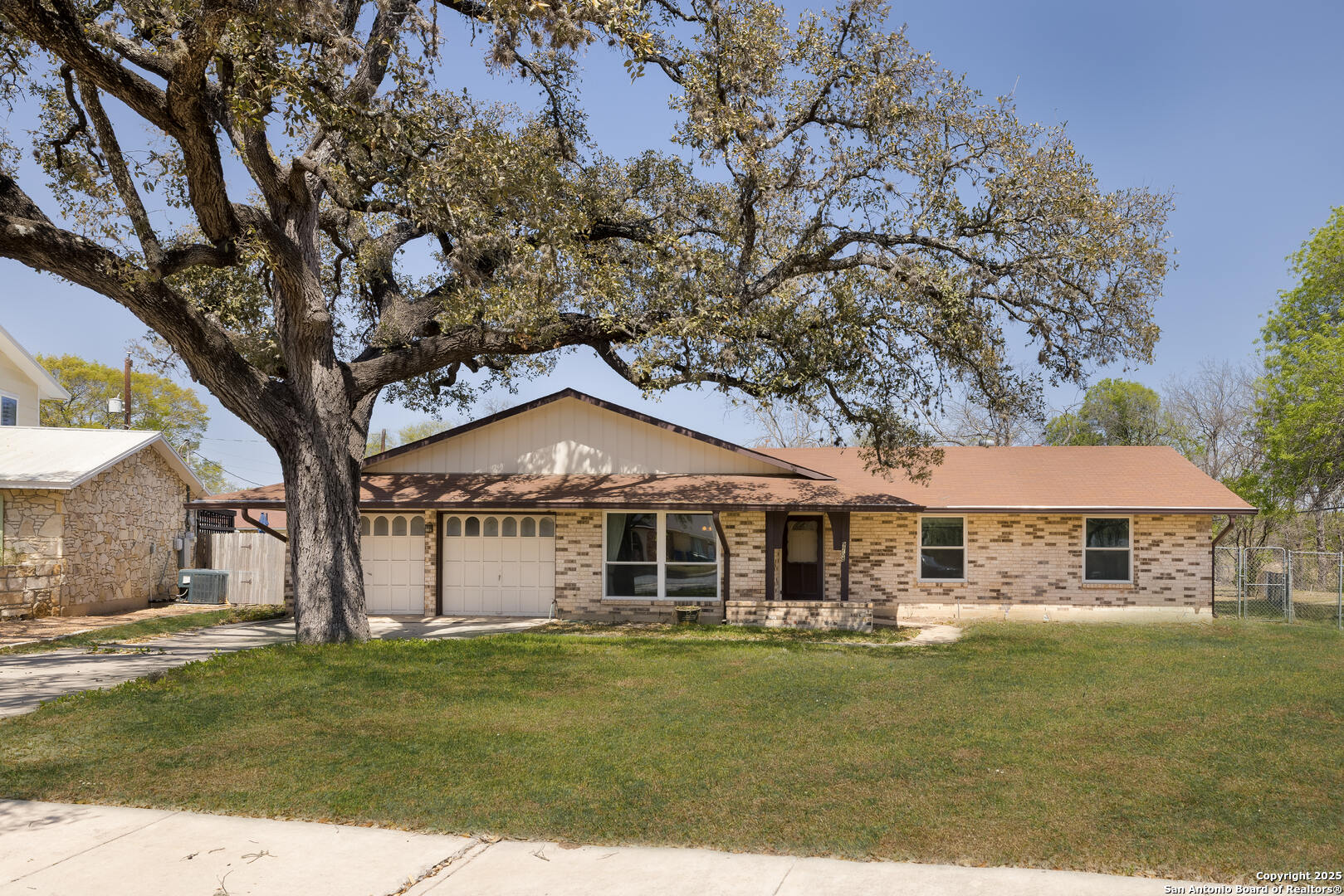 9708 Gemini Drive San Antonio, TX 78217 - Photo 1 of 24 a front view of a house with a garden