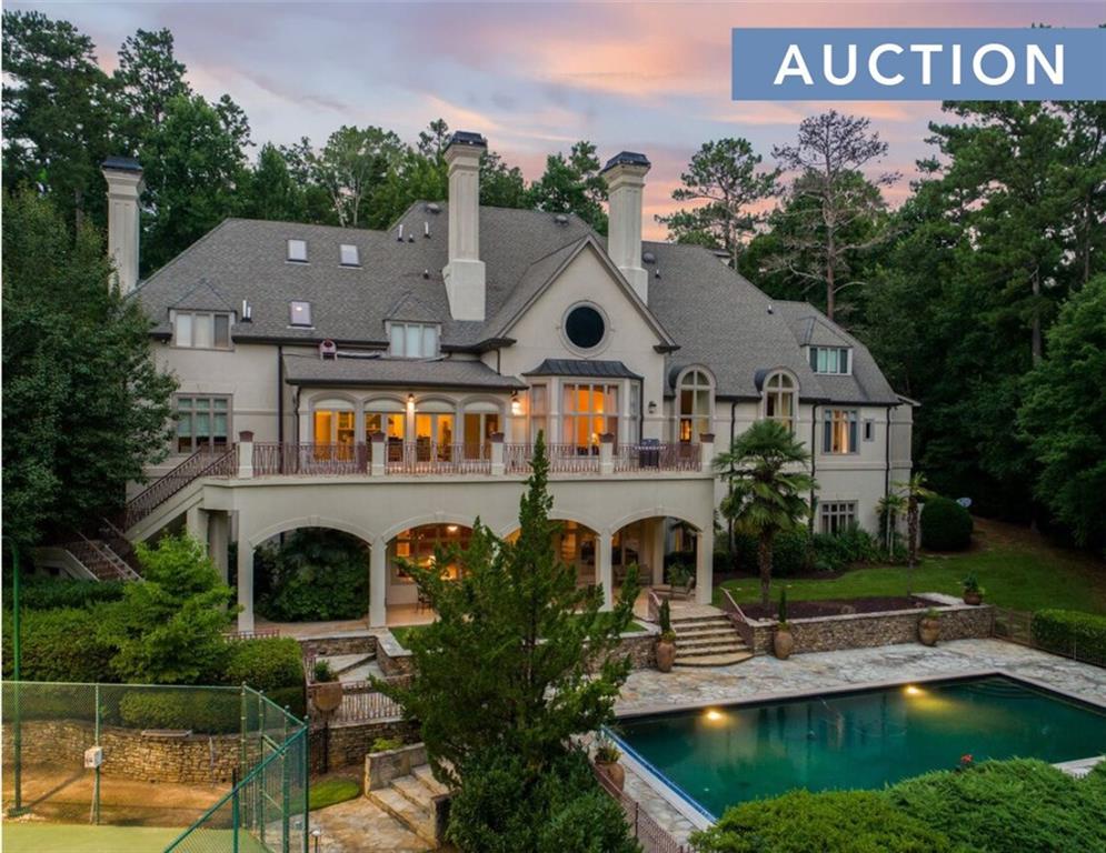 a front view of house with yard and swimming pool