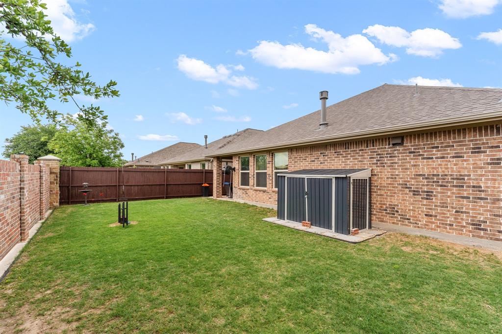 300 Copper Switch Drive Anna, TX 75409 - Photo 21 of 26 Backyard with storage unit