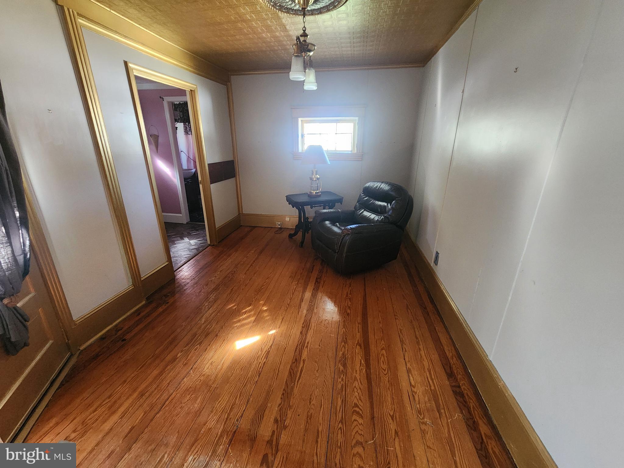 224 North State Street Dover, DE 19901 - Photo 13 of 43 a view of a hallway with wooden floor and stairs