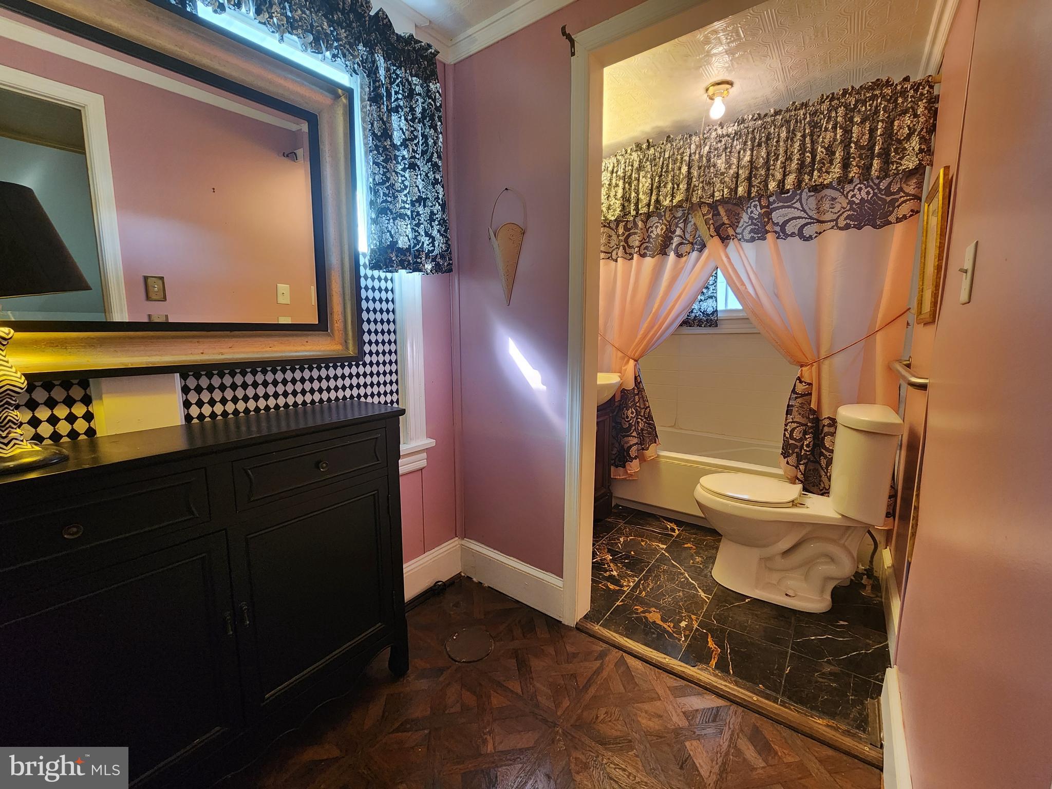 224 North State Street Dover, DE 19901 - Photo 15 of 43 a bathroom with a toilet a sink and mirror