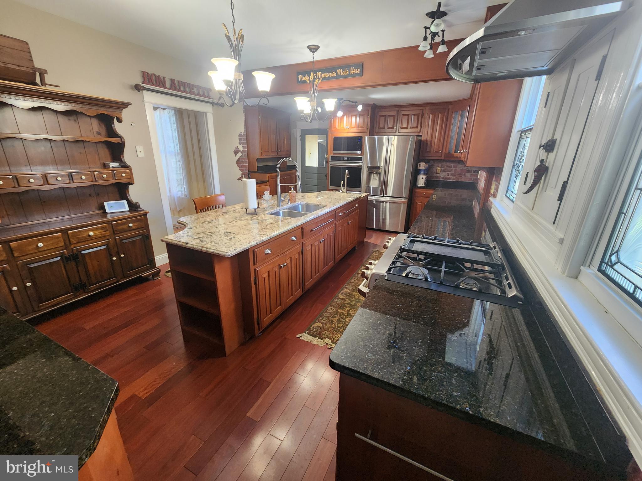 224 North State Street Dover, DE 19901 - Photo 20 of 43 a kitchen with stainless steel appliances granite countertop a stove and a refrigerator