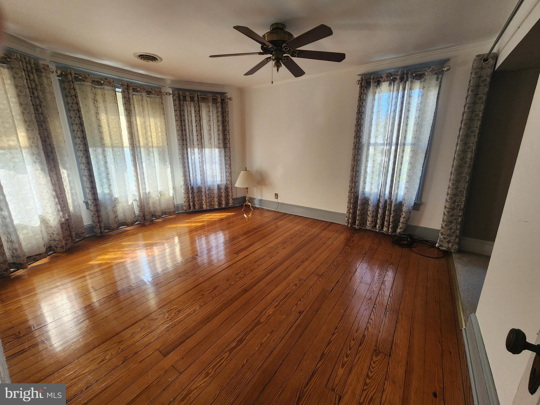 224 North State Street Dover, DE 19901 - Photo 24 of 43 an empty room with wooden floor and windows