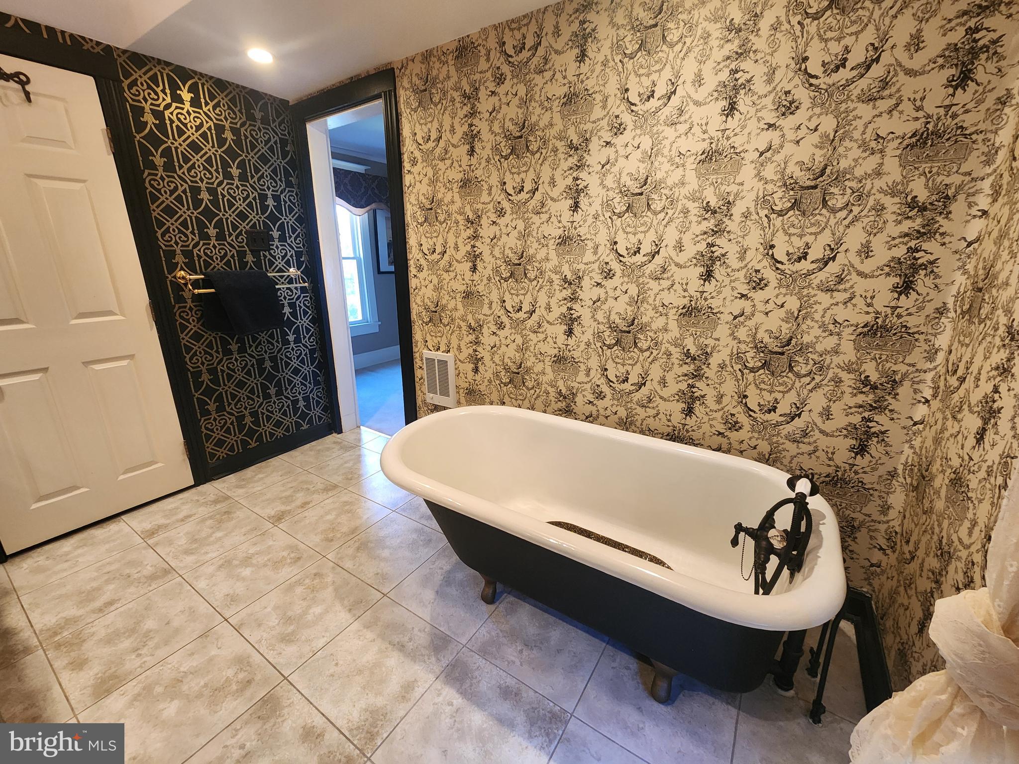 224 North State Street Dover, DE 19901 - Photo 29 of 43 a bath tub sitting in a bathroom next to a sink