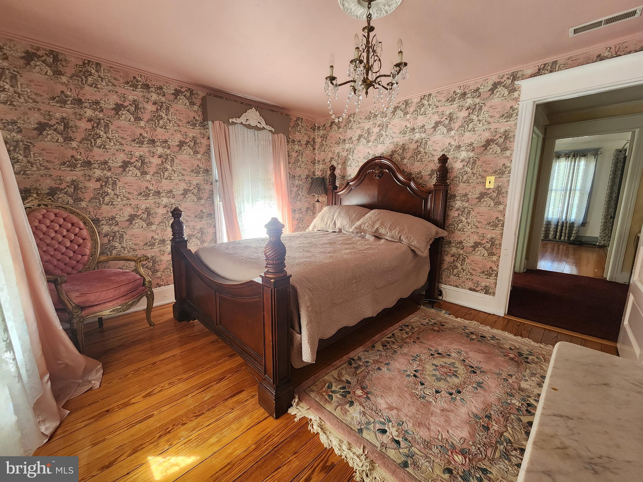 224 North State Street Dover, DE 19901 - Photo 34 of 43 a bedroom with a bed and wooden floor