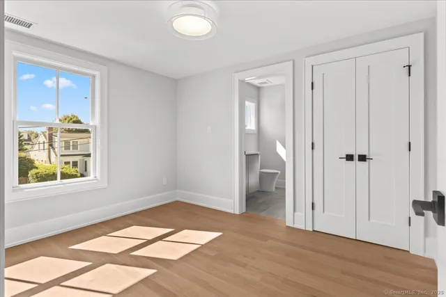 a bathroom with a sink toilet and a mirror