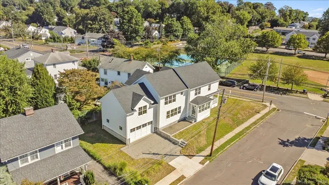 an aerial view of a house with a ocean view
