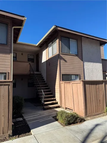 a front view of a house with stairs