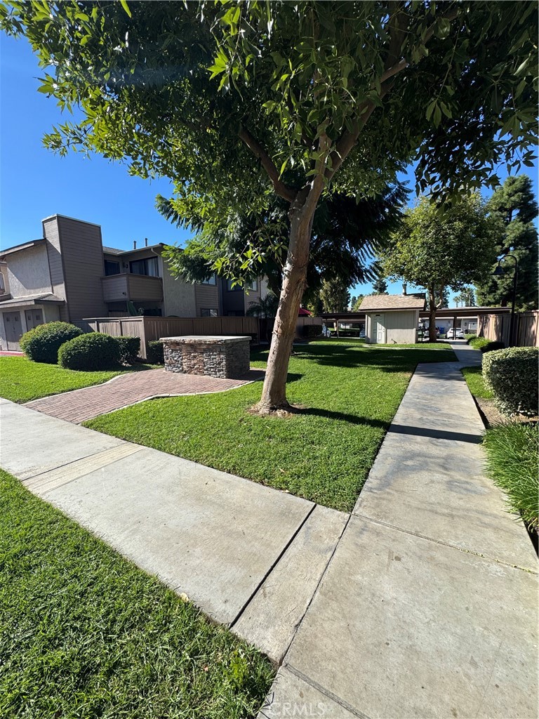 1315 Massachusetts Avenue, Unit 101 Riverside, CA 92507 - Photo 11 of 11 a front view of a house with garden